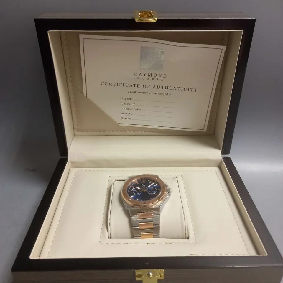BOXED RAYMOND GAUDIN WATCH IN BLUE/GOLD/SILVER