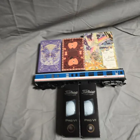 TOTE OF APPROXIMATELY 5 ASSORTED TOYS AND GAMES TO INCLUDE MODEL TRAINS, CARD GAMES AND GOLF BALLS 