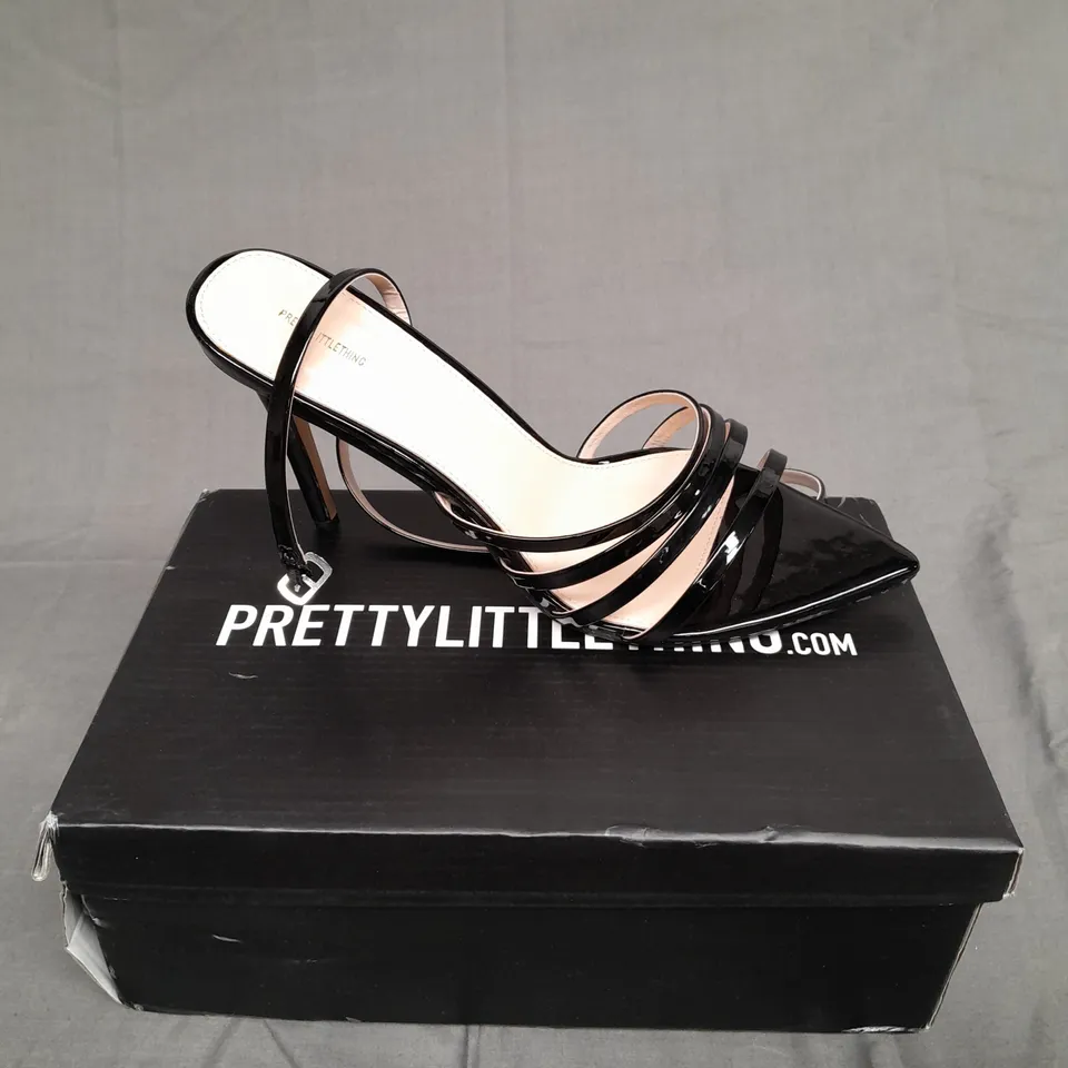 BOXED PAIR OF PRETTYLITTLETHINGS BLACK WIDE FIT POINT TOE STRAPPY STILETTO HEELS SIZE 7 