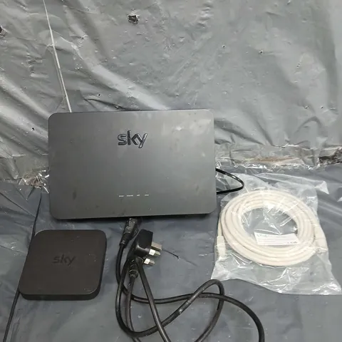 TOTE OF APPROXIMATELY 15 ELECTRICAL ITEMS TO INCLUDE - POWER CABLES - SKY WIFI HUB - SKY MINI BOX