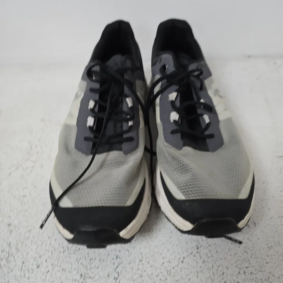 UNBOXED PAIR OF ON RUNNING CLOUDVISTA TRAIL RUNNING SHOES IN A BLACK AND WHITE COLORWAY - UK 6.5