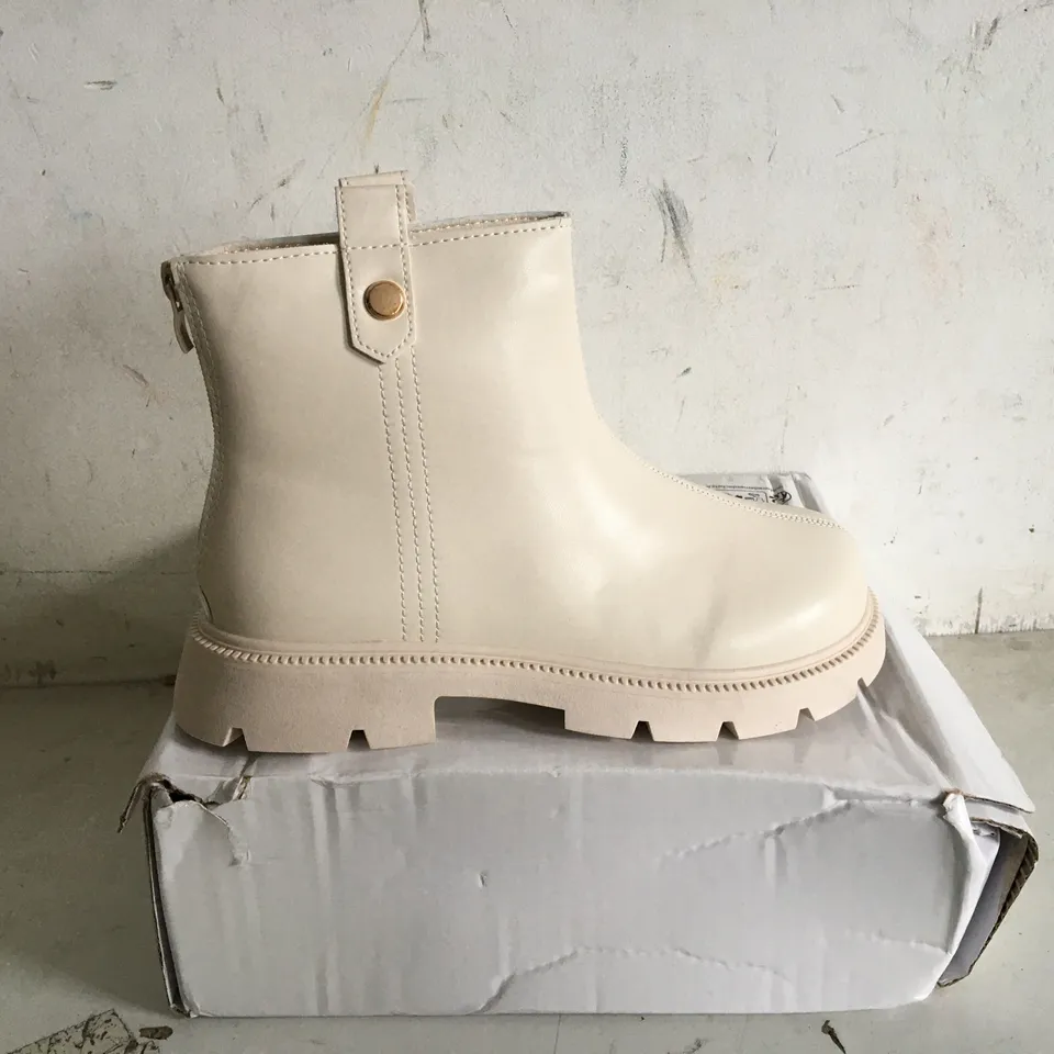 BOXED PAIR OF SIZE 37 CREAM FAUX LEATHER BOOTS