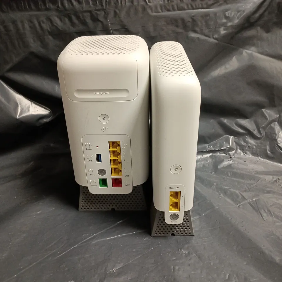 SET OF 2 WHITE NETWORK DEVICES WITH PERFORATED TOPS AND METAL FEET 