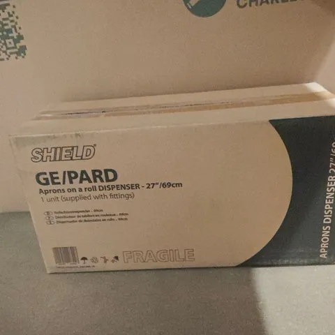 BOXED SHIELD GE/PARD APRONS ON A ROLL DISPENSER 