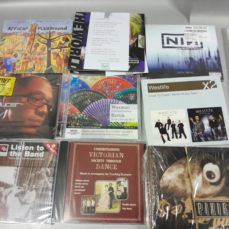 LOT OF APPROXIMATELY 40 ASSORTED MEDIA ITEMS TO INCLUDE MONTY PYTHON SINGS, THE WORLDS GRETEST 3CD SET AND KINGS OF LEON