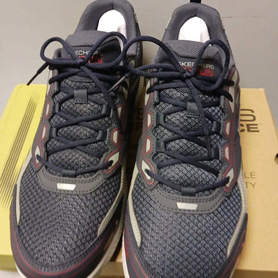 BOXED PAIR OF SKECHERS GO RUN CONSISTENT TRAINERS, NAVY/RED - UK SIZE 11