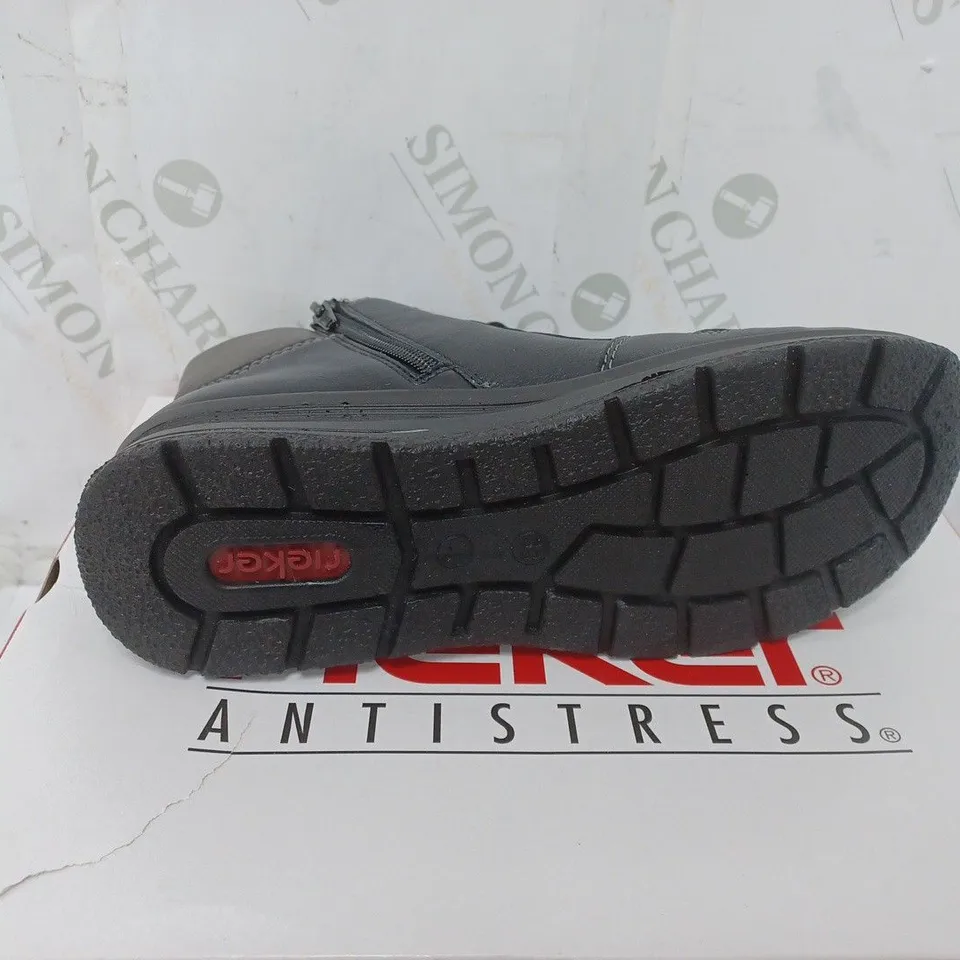 BOXED PAIR OF RIEKER WATER RESISTANT BOOTS IN BLACK SIZE 5