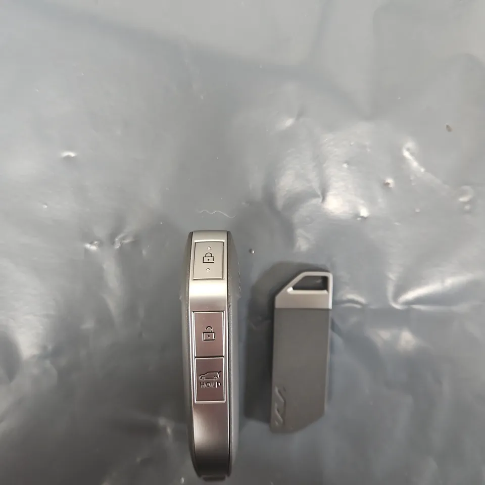 KIA CAR KEY FOB WITH THREE-FUNCTION BUTTONS AND METAL KEY TAG (VERIFY MODEL)