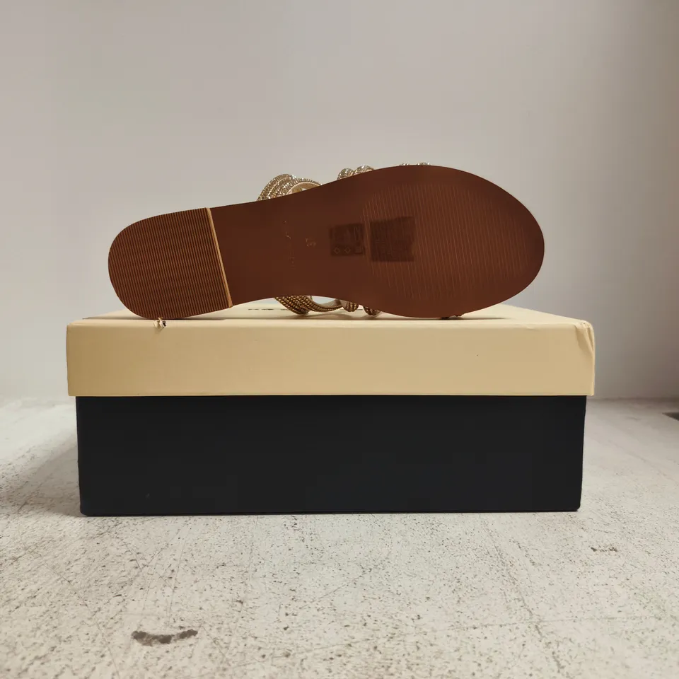 BOXED PAIR OF KURT GEIGER PERLA OPEN TOE FLAT SANDALS IN GOLD W. JEWEL DETAIL SIZE EU 37