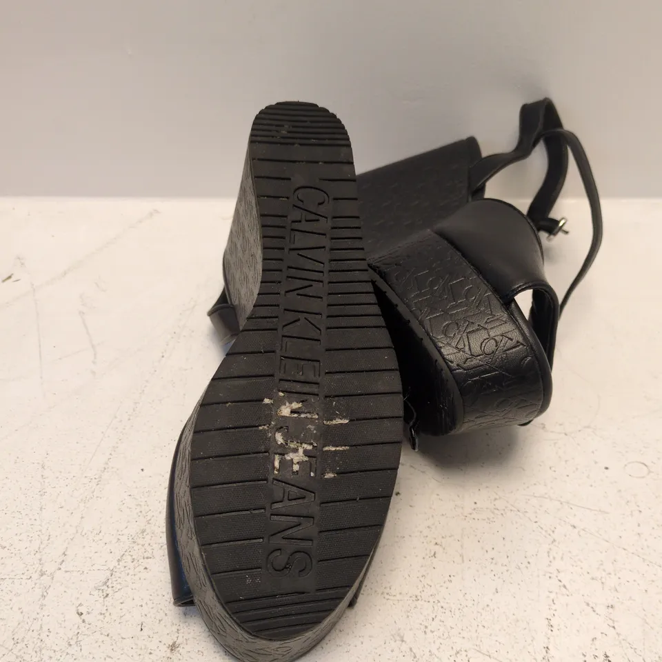 CALVIN KLEIN JEANS BLACK WEDGE SANDALS – ANKLE STRAP