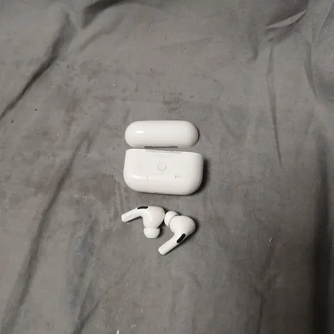 WHITE WIRELESS EARBUDS WITH CHARGING CASE. MODEL UNSPECIFIED.