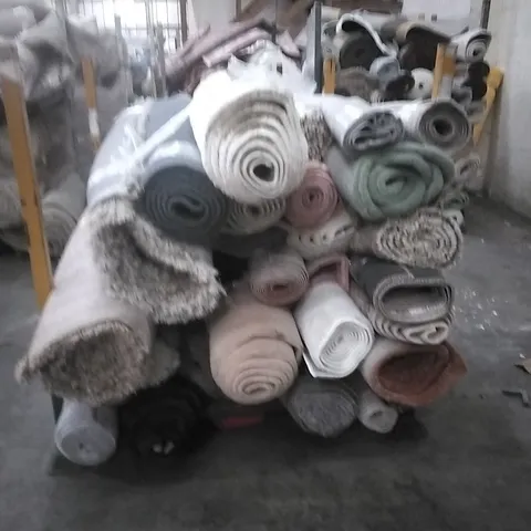 STILLAGE OF APPROXIMATELY 24 DESIGNER RUGS