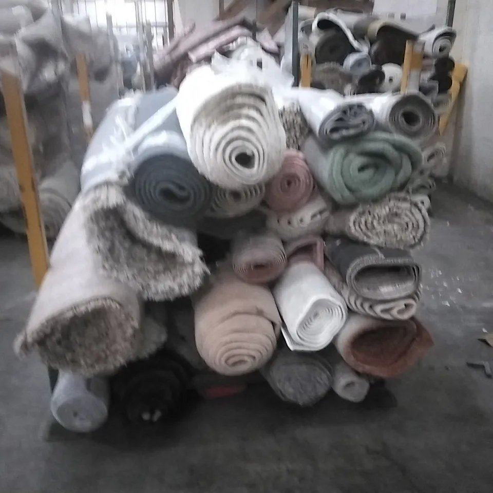 STILLAGE OF APPROXIMATELY 24 DESIGNER RUGS