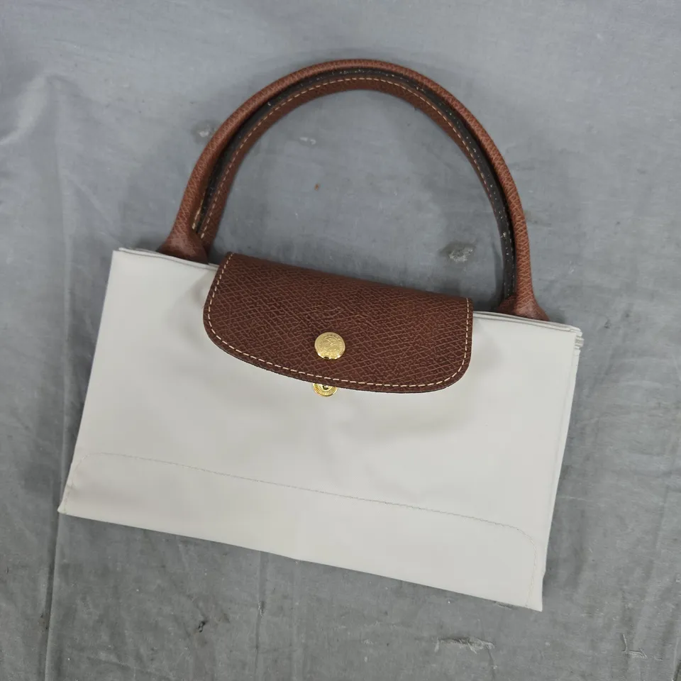 WHITE HANDBAG WITH BROWN LEATHER TOP FLAP AND HANDLES