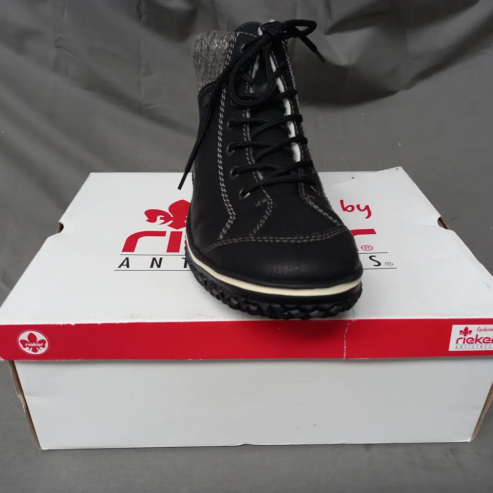 BOXED PAIR OF RIEKER WATER RESISTANT BOOTS IN BLACK SIZE 8