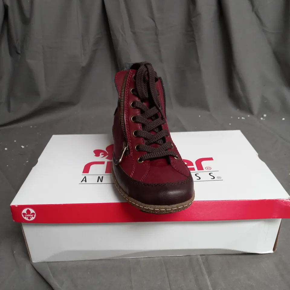 BOXED PAIR OF RIEKER SIDE ZIP WATER RESISTANT BOOTS IN BURGUNDY SIZE 6