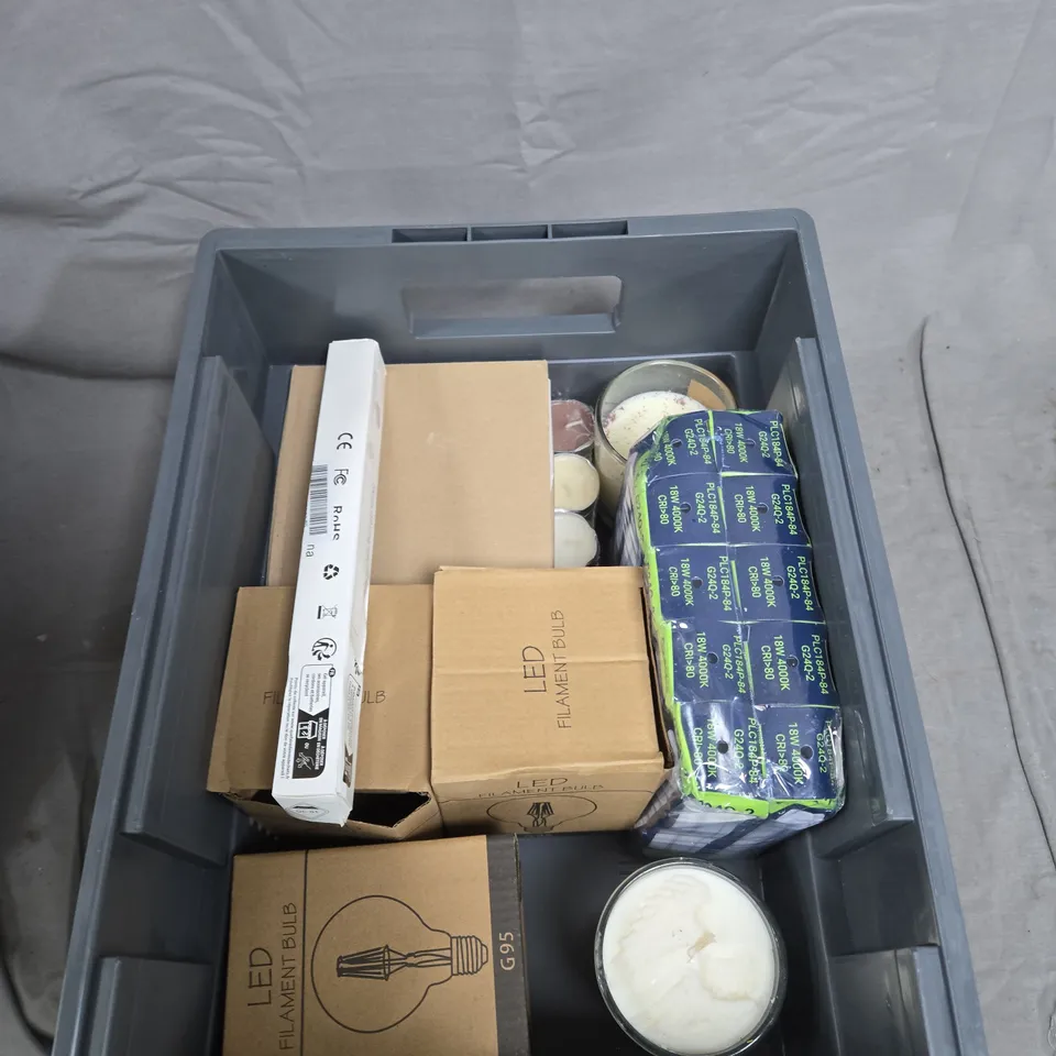 TOTE OF APPROXIMATELY 10 ASSORTED ITEMS TO INCLUDE: LIGHTBULBS AND CANDLES 