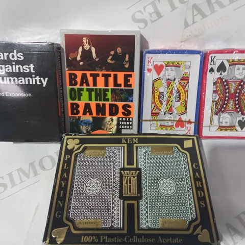 BOX OF APPROXIMATELY 5 ASSORTED HOUSEHOLD ITEMS TO INCLUDE CARDS AGAINST HUMANITY THIRD EXPANSION, BATTLE OF THE BANDS ROCK TRUMP CARDS, KEM PLASTIC PLAYING CARDS, ETC