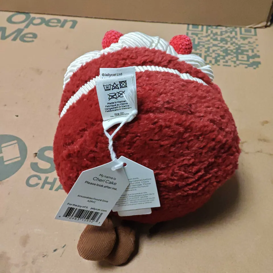 JELLYCAT CHERI CAKE PLUSH TOY – RED CAKE-SHAPED SOFT TOY WITH WHITE ICING