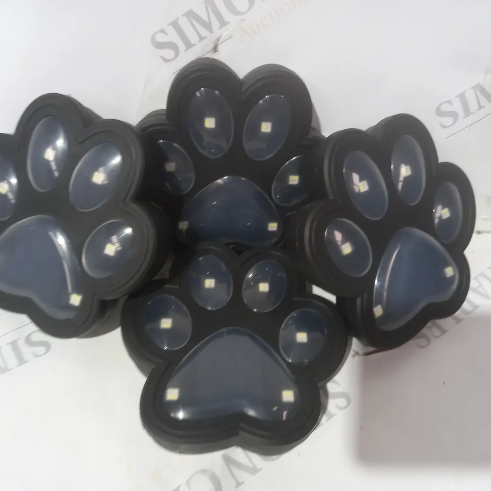 BOXED BELL AND HOWELL SET OF 4 SOLAR PAW LIGHTS