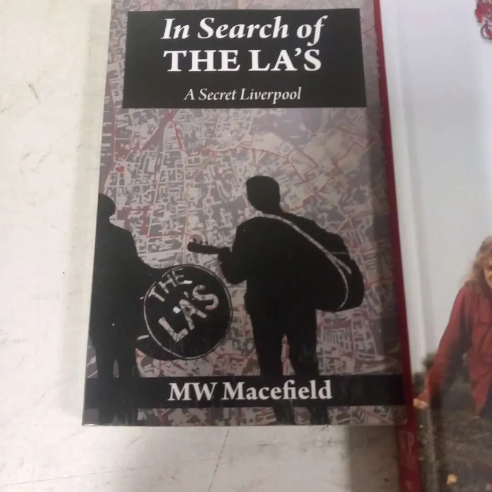 APPROXIMATELY SIX ASSORTED MUSIC BOOKS TO INCLUDE; BEATLES ANNIVERSARY MAGAZINE, JETHRO TULL CHRONICLES 1967-79, CUREPEDIA, BTS BEYOND THE STORY, I AM HATED FOR LOVING DICKIE FELTON AND IN SEARCH OF T
