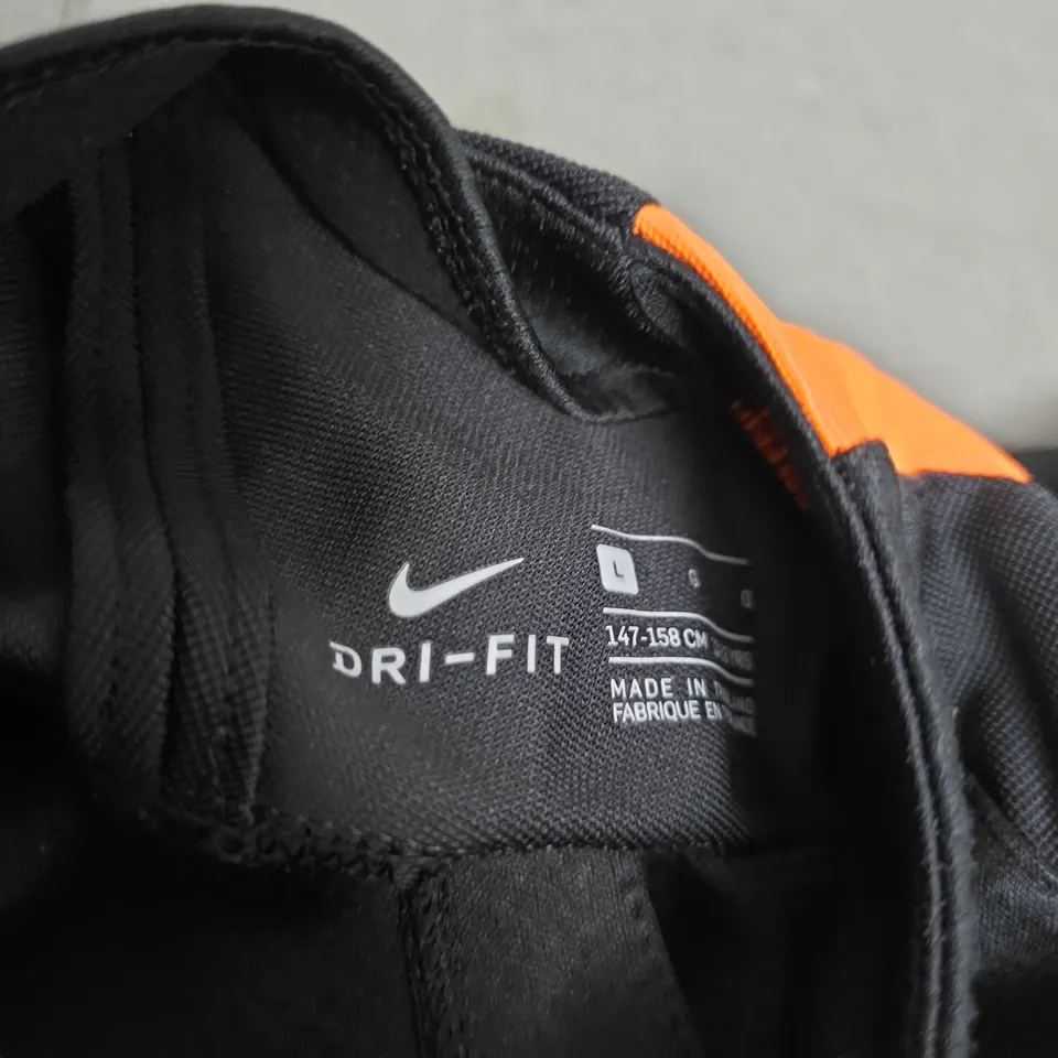 NIKE DRI-FIT TRAINING TOP, BLACK WITH ORANGE STRIPES – KIDS’ SIZE L (147-158 CM)