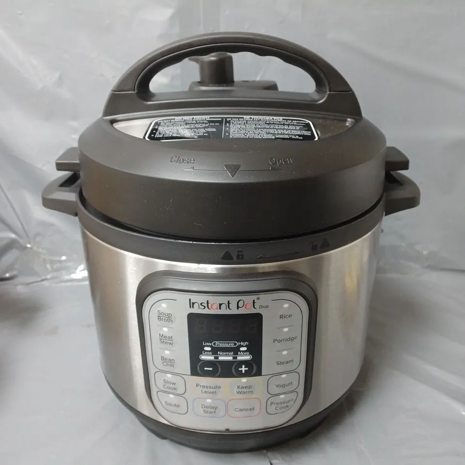 BOXED INSTANT POT DUO MULTI-USE PRESSURE COOKER