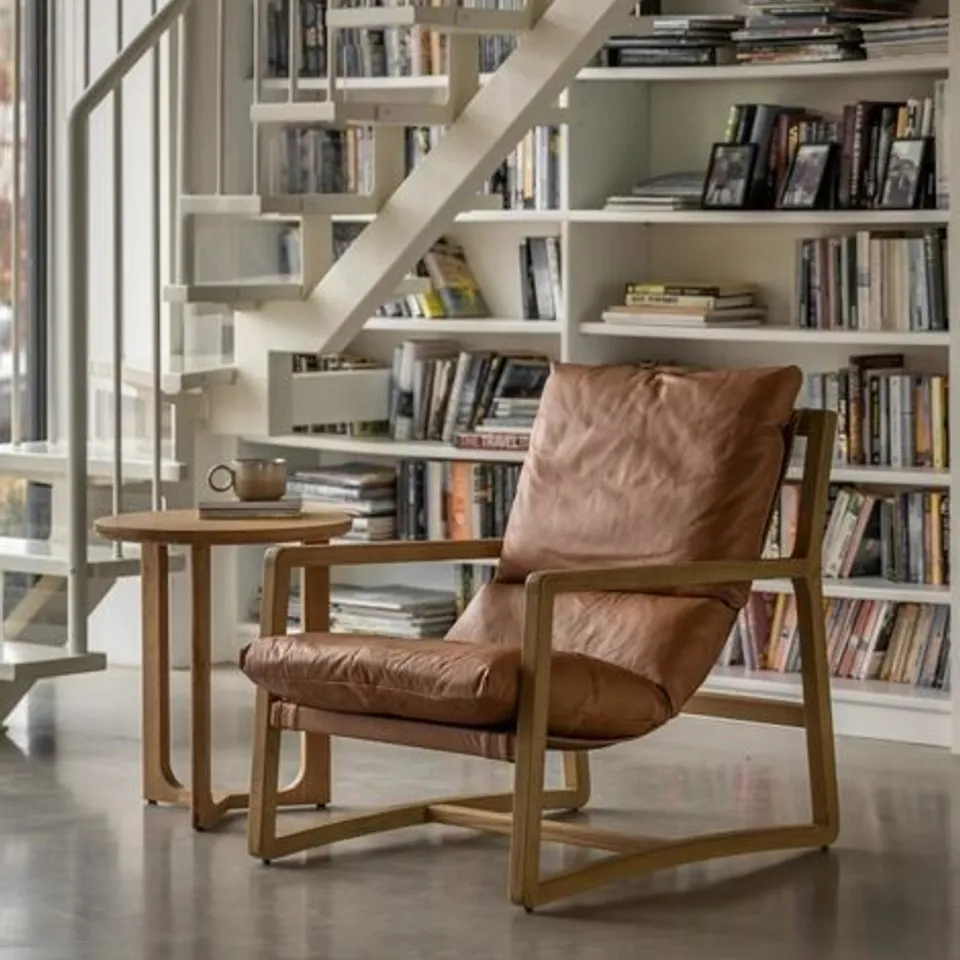 BOXED BURELA LOUNGE CHAIR VINTAGE BROWN LEATHER (1 BOX)