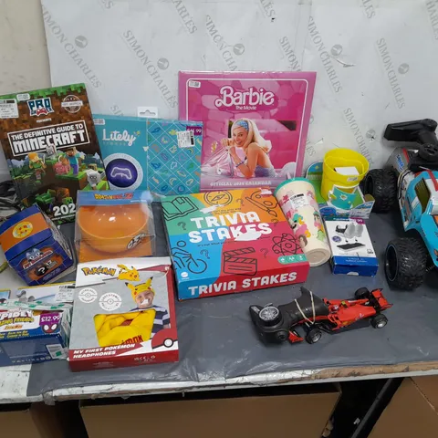 LARGE BOX OF ASSORTED TOYS TO INCLUDE RC CARS, BARBIE CALENDAR, DRAGONBALL Z BOWL, AND IRONMAN RACER ETC.