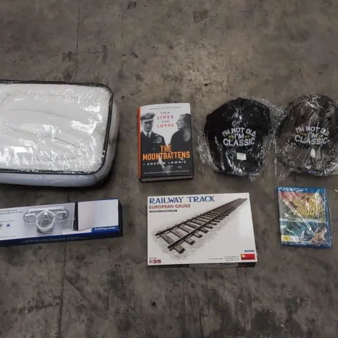 PALLET OF ASSORTED HOUSEHOLD ITEMS AND CONSUMER PRODUCTS. INCLUDES HATS, BOOK, BABY NEST, VR HEADSET RACK, HOBBY RAILWAY TRACK ETC