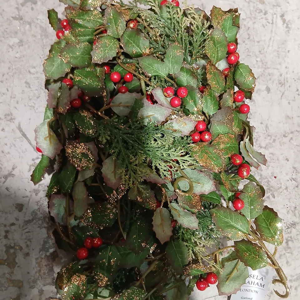 TWO GISELA GRAHAM ARTIFICIAL CHRISTMAS GARLAND WITH HOLLY LEAVES, RED BERRIES AND GLITTER