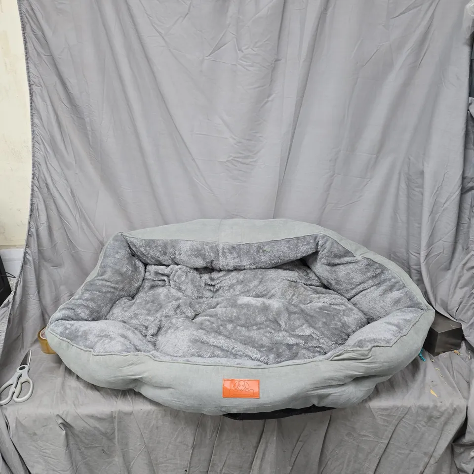 GREY PLUSH PET BED WITH CUSHIONED OVAL SHAPE AND SOFT INTERIOR
