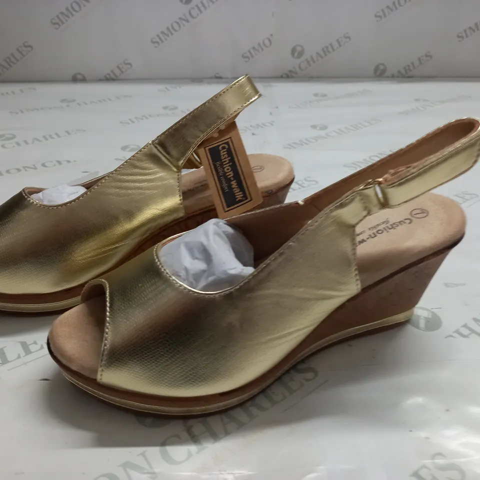 BOXED PAIR OF CUSHION WALK GOLD STRAPPY WEDGE HEELED SHOES - SIZE 7