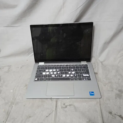 DELL LAPTOP – INTEL CORE I5, SILVER WITH POWER PACK. POWERS ON. MULTIPLE KEYS MISSING