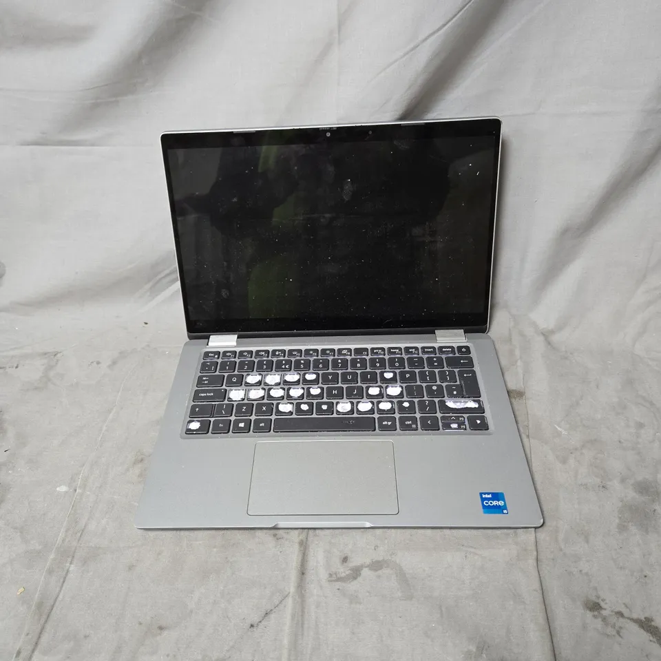 DELL LAPTOP – INTEL CORE I5, SILVER WITH POWER PACK. POWERS ON. MULTIPLE KEYS MISSING
