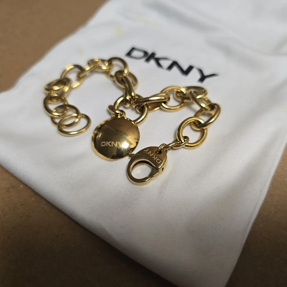 DKNY GOLD TONE PENDANT BRACELET 