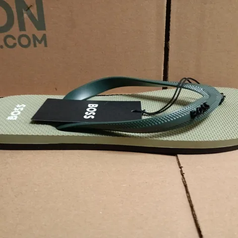 BOXED PAIR OF BOSS TRACY LOGO FLIP FLOPS IN LIGHT GREEN SIZE 7