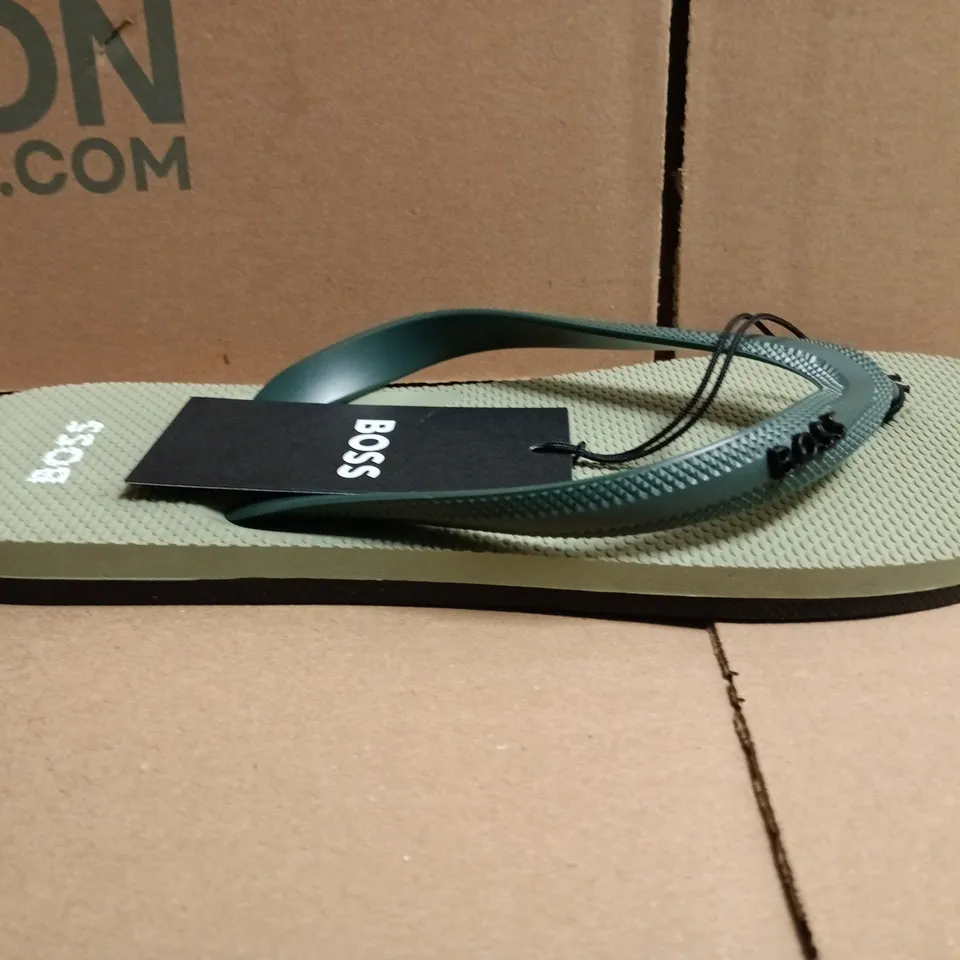 BOXED PAIR OF BOSS TRACY LOGO FLIP FLOPS IN LIGHT GREEN SIZE 7