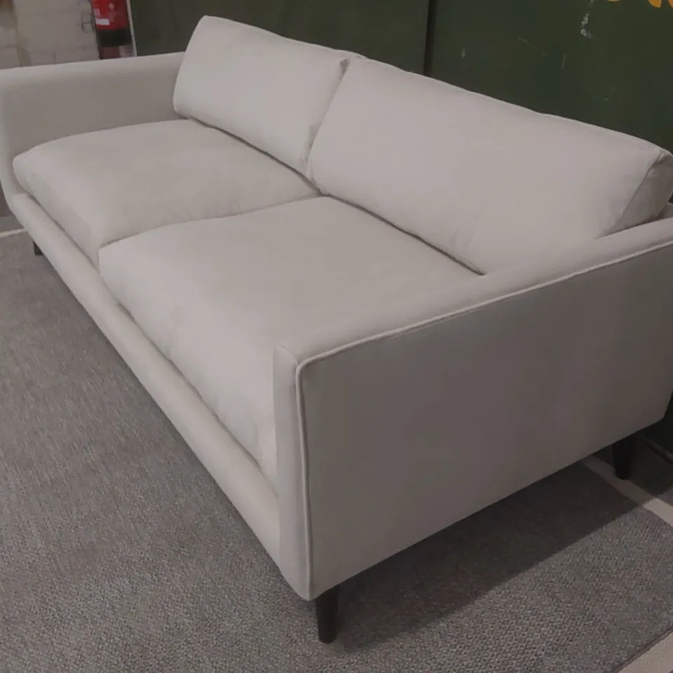 QUALITY EX-SHOWROOM LARGE THREE SEATER SOFA UPHOLSTERED IN SOFT OFF-WHITE FABRIC