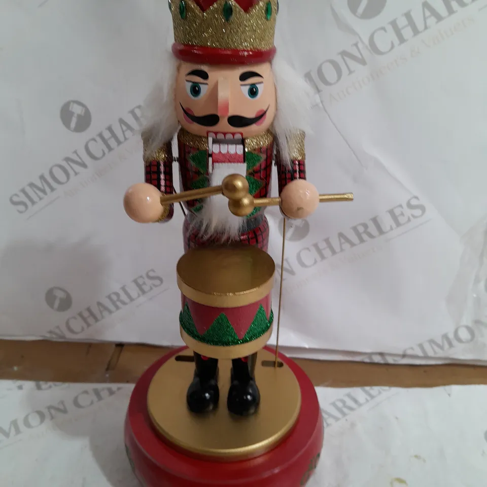 FESTIVE 32CM WOODEN ANIMATED MUSICAL NUTCRACKER