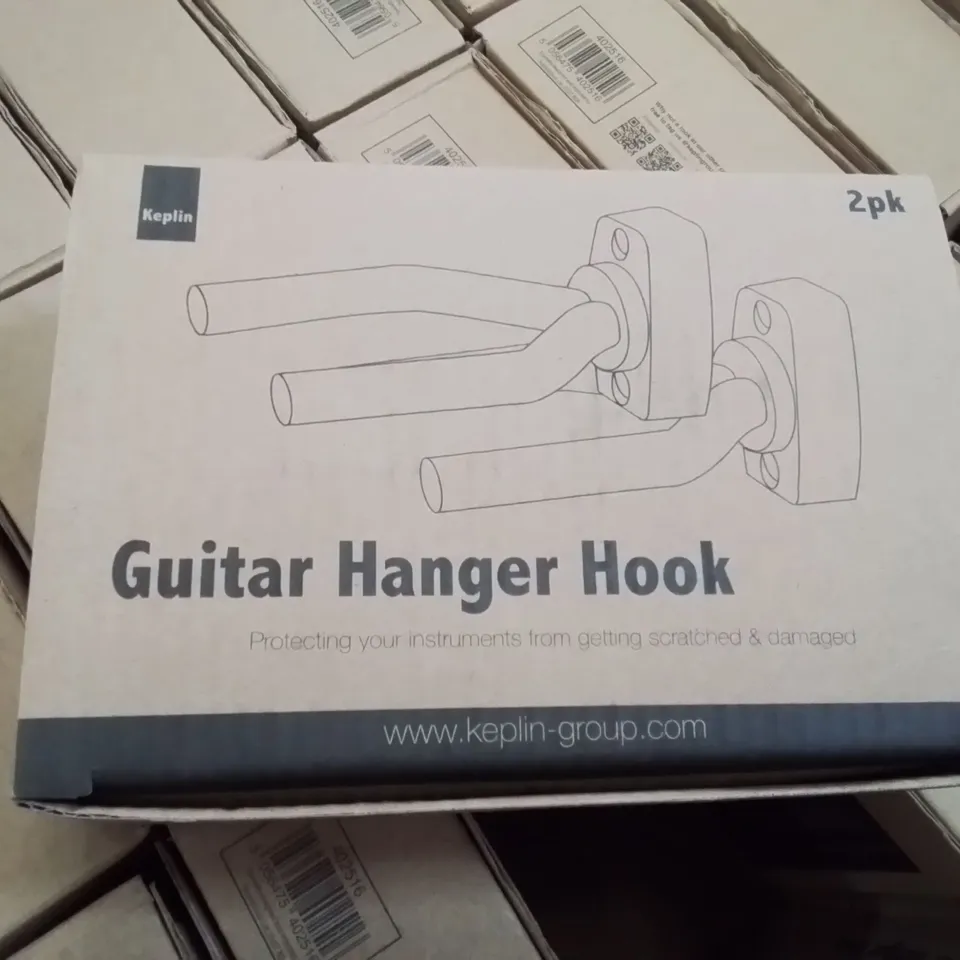 BOX CONTAINING APPROXIMATELY 40 X2 PKS OF GUITAR HOOKS