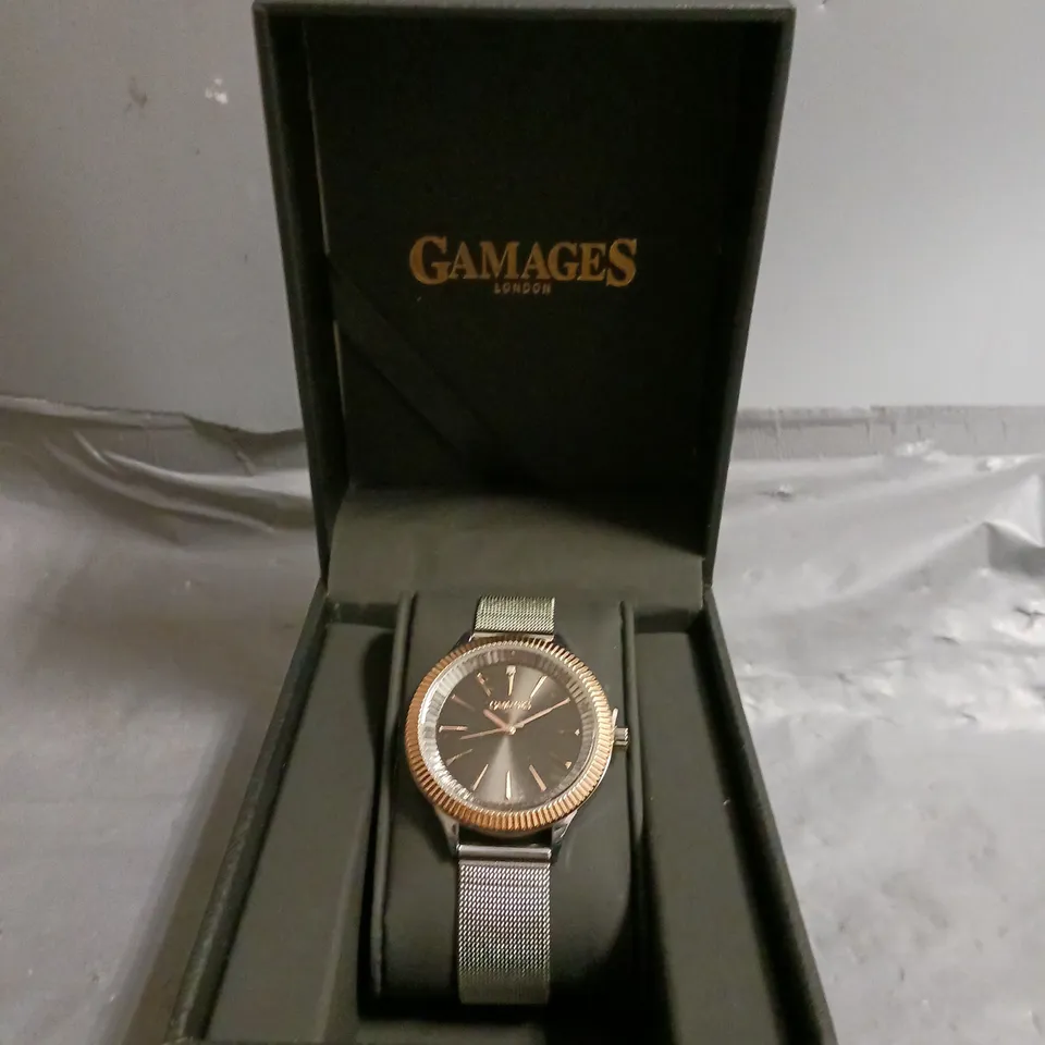 BOXED GAMAGES FLUTED DIAMOND BLACK DIAL WATCH