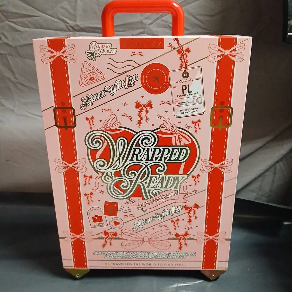 PLOUISE WRAPPED & READY WHEELED SUITCASE SKINCARE GIFT SET