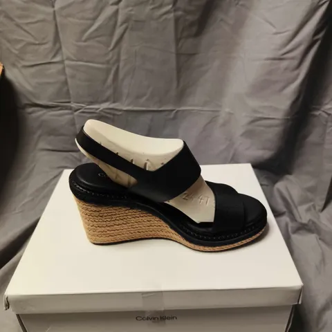 BOXED PAIR OF CALVIN KLEIN BLACK LEATHER WEDGE SANDALS – WOMEN'S SIZE 6 