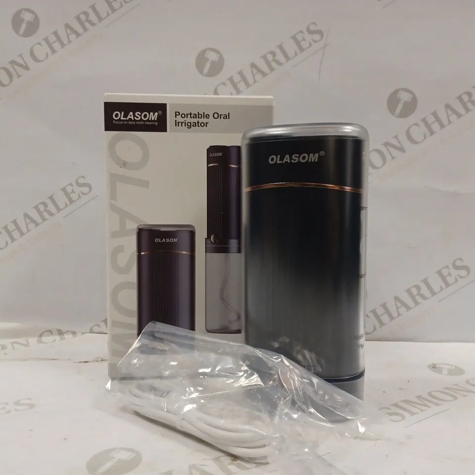 OLASOM PORTABLE ORAL IRRIGATOR