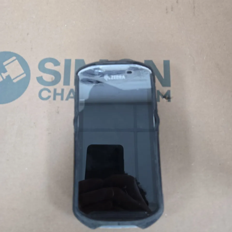 TOTE OF APPROXIMATELY 12 ASSORTED ITEMS TO INCLUDE: ZEBRA SCANNER