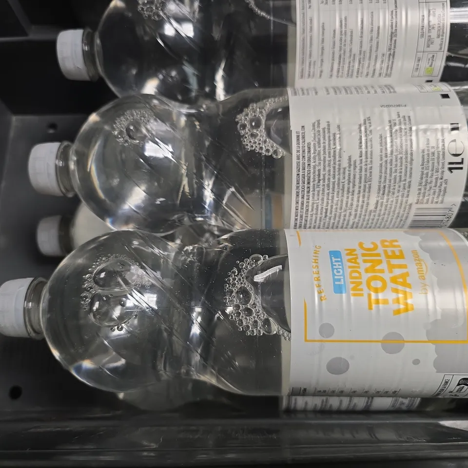 APPROXIMATELY 7 ASSORTED DRINK ITEMS TO INCLUDE - INDIAN TONIC WATER , HUEL BANANA 