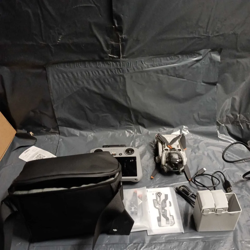 DJI Drone kit with integrated-screen controller, batteries & charger – carry case