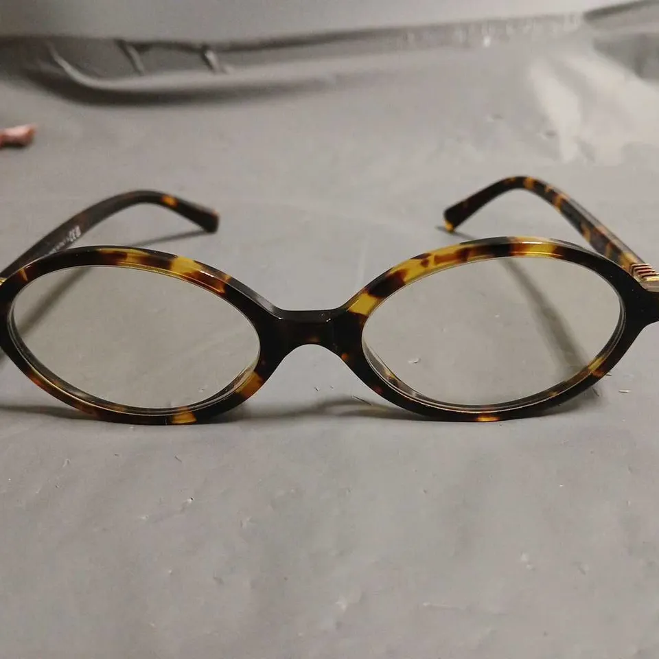 BOXED PAIR OF MIU MIU BROWN PATTERENED GLASSES