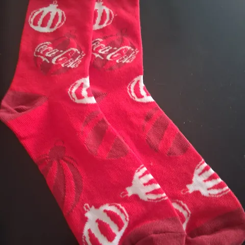 APPROXIMATELY 300 PAIRS OF BRAND NEW COCA COLA CHRISTMAS SOCKS